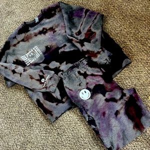 Custom made sweatsuits. Reversed tie dye and crunch dye with custom decals.